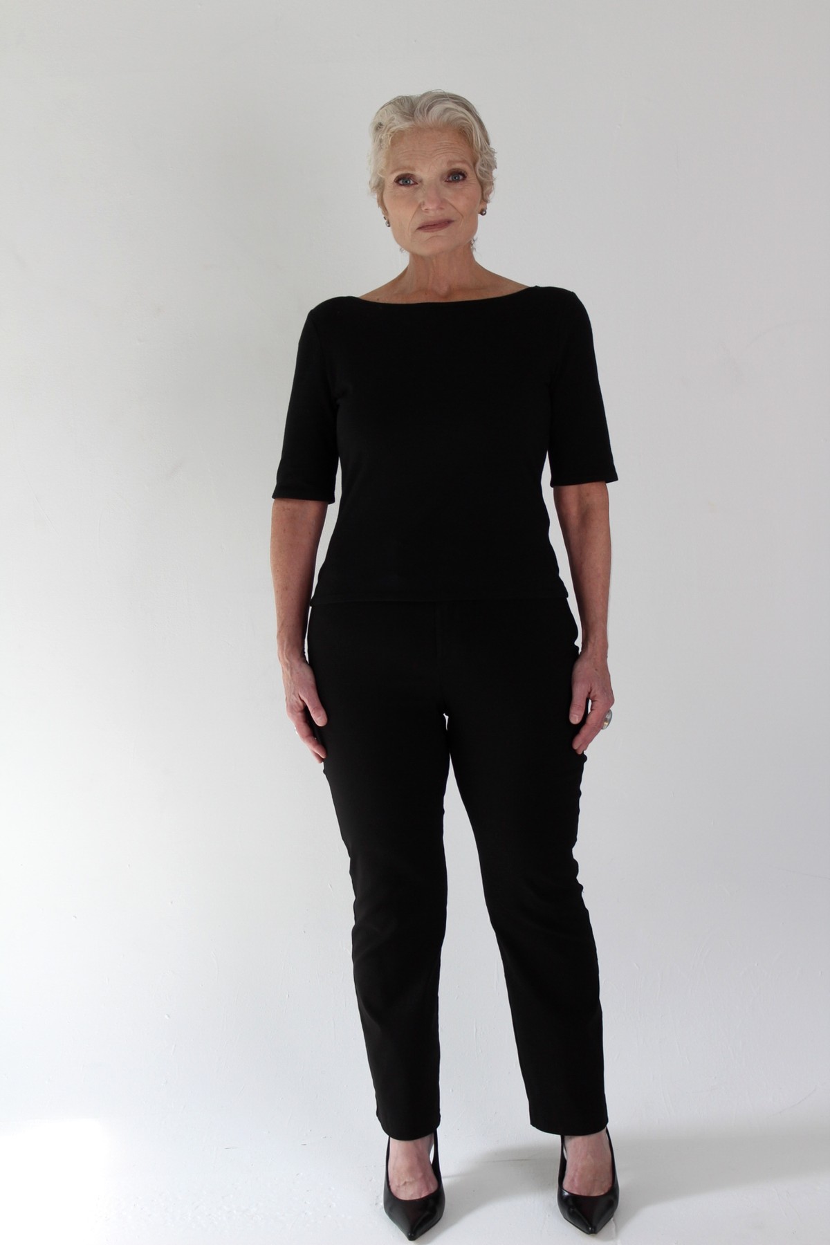 Catherine Handy, full body, black top and trousers
