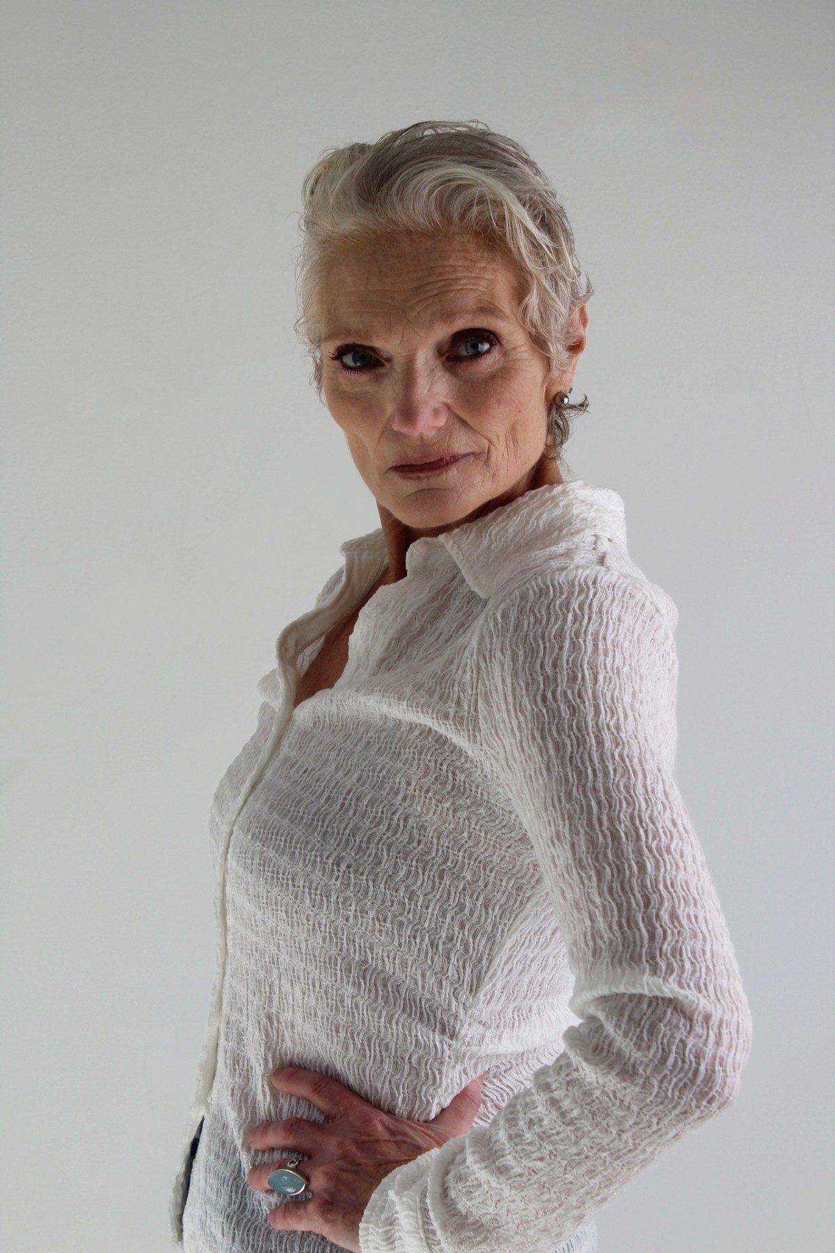 Catherine Handy, editorial three-quarter, hand on hip, white shirt, photographer Alexandra Martinez Studio