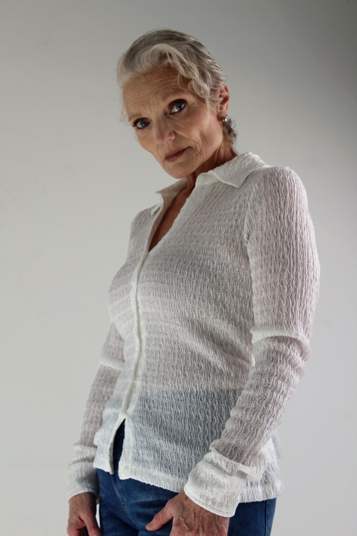 Catherine Handy, editorial three-quarter in a white shirt and jeans, photographer Alexandra Martinez Studio